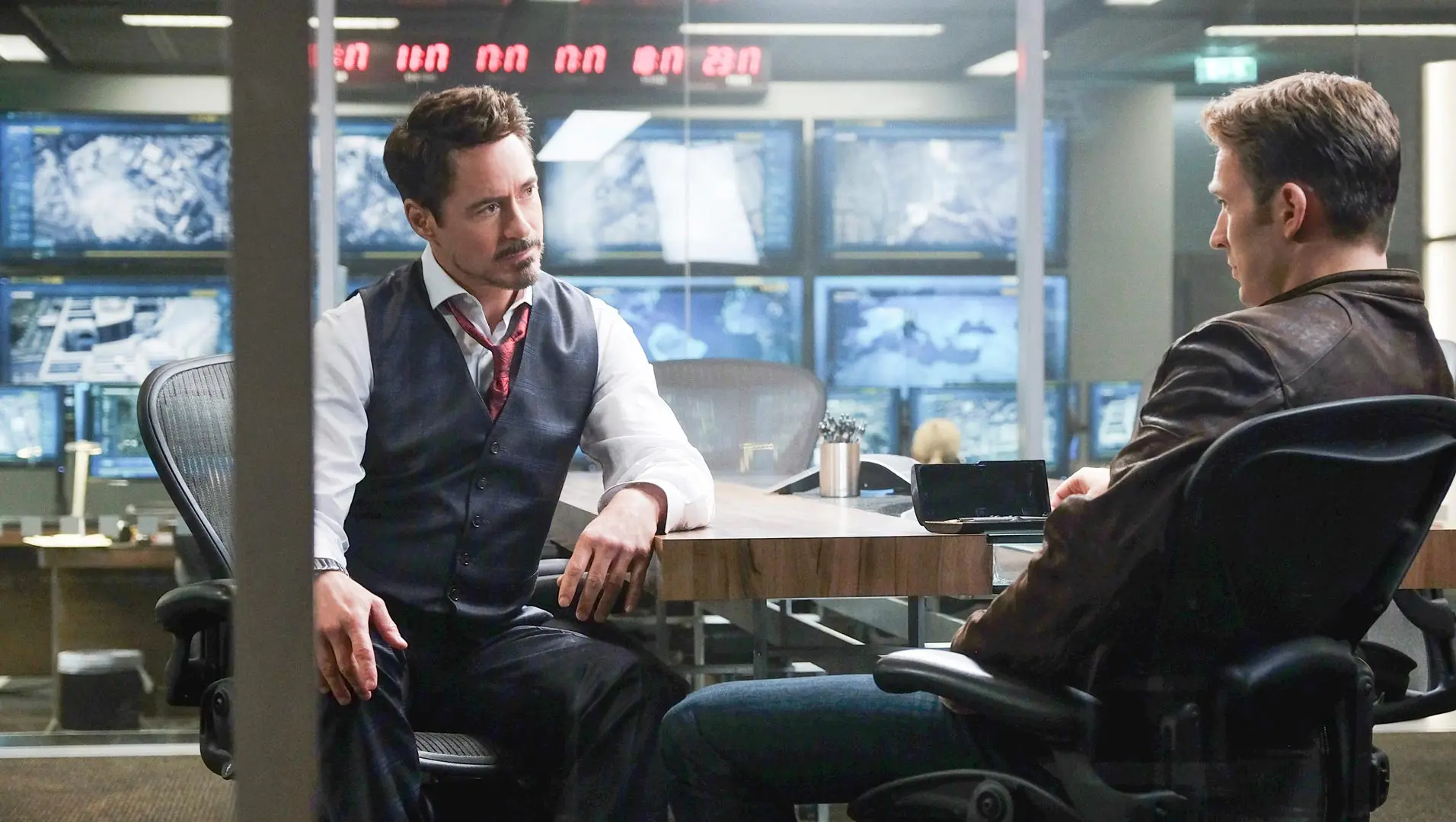 iron-man-captain-america-looking-at-eachother-in-office